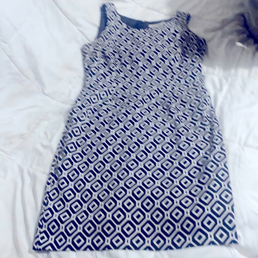 Shift dress, zips up back, lined inside,cute with high boots. Very fun!